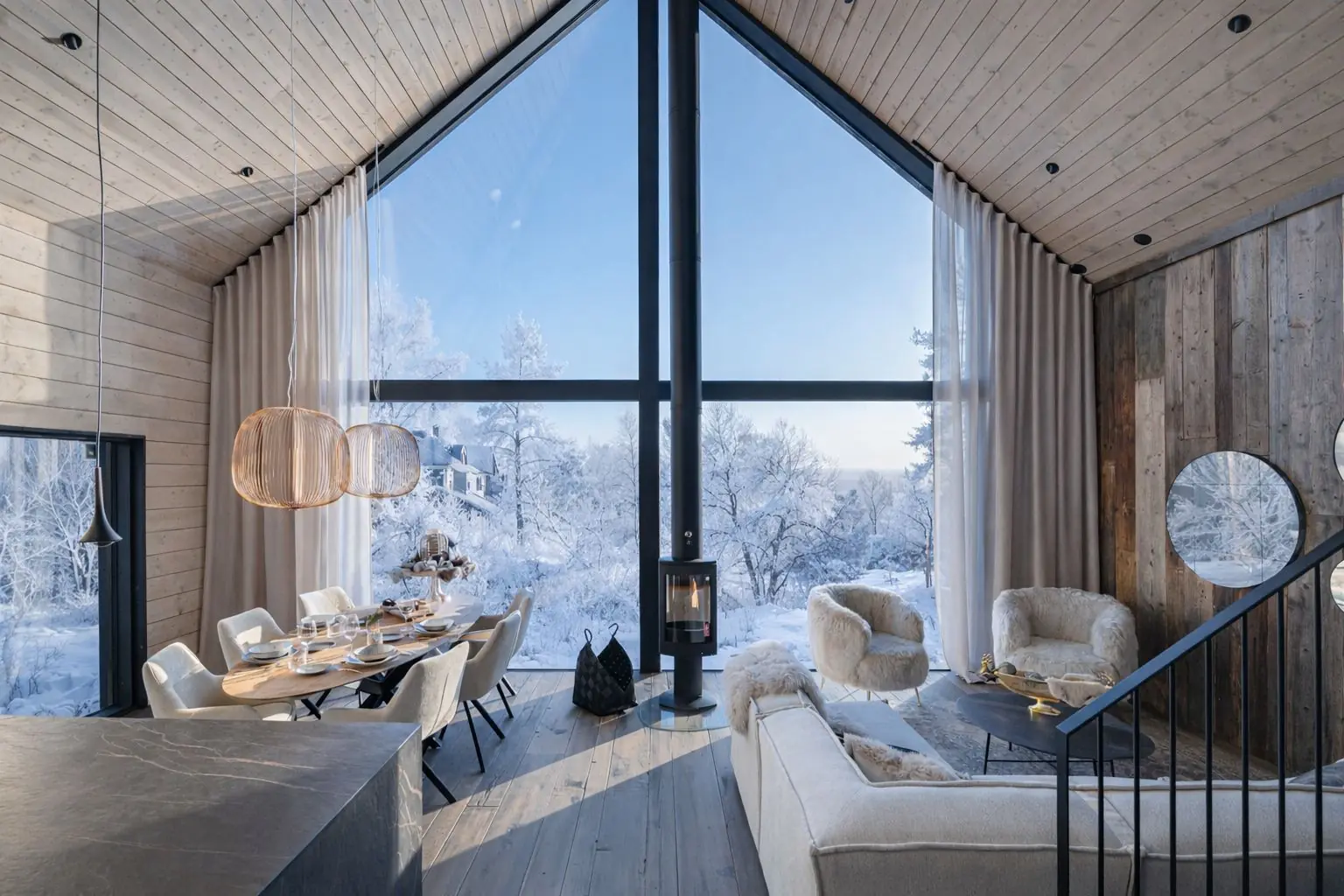 Grand Hideaway living room with frost-covered windows at Aura Arctic Chalets, Saariselkä