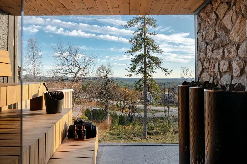 Private sauna with an open autumn view over the forest