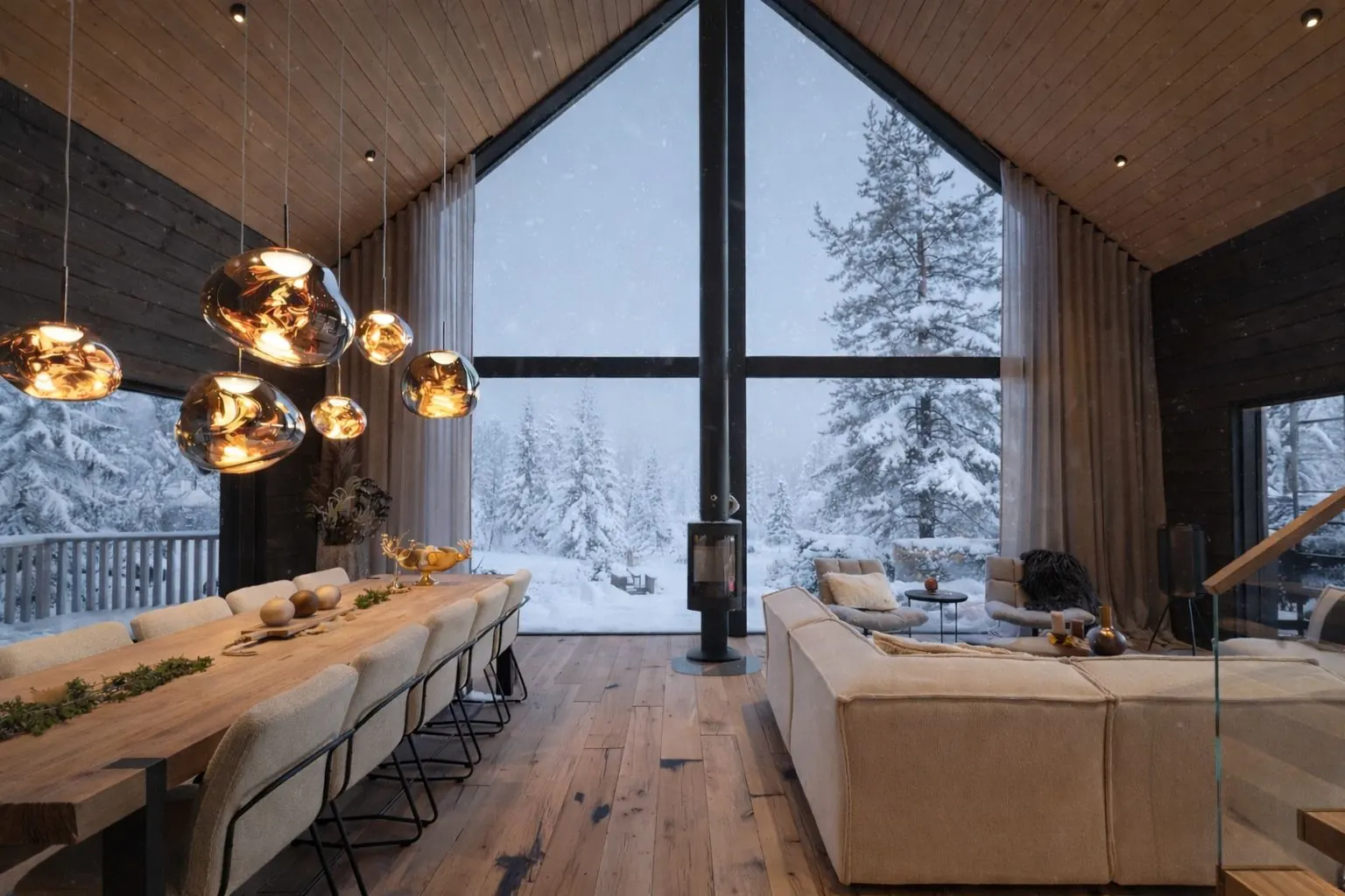 Cosy fireplace atmosphere inside Aura Arctic Chalets living room during winter in Saariselkä